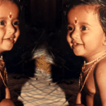 Smiling and sitting on the bed, this little girl is now a Tollywood actress, do you recognize her?