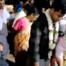 Keeping the dead body of the mother beside her, the young girl put garlands around her lover's neck, witnessed by the funeral procession